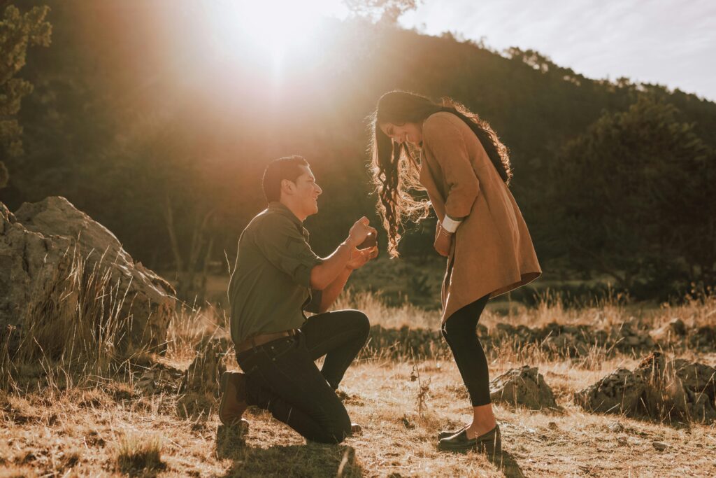 man giving his proposal speech to his excited girlfriend
